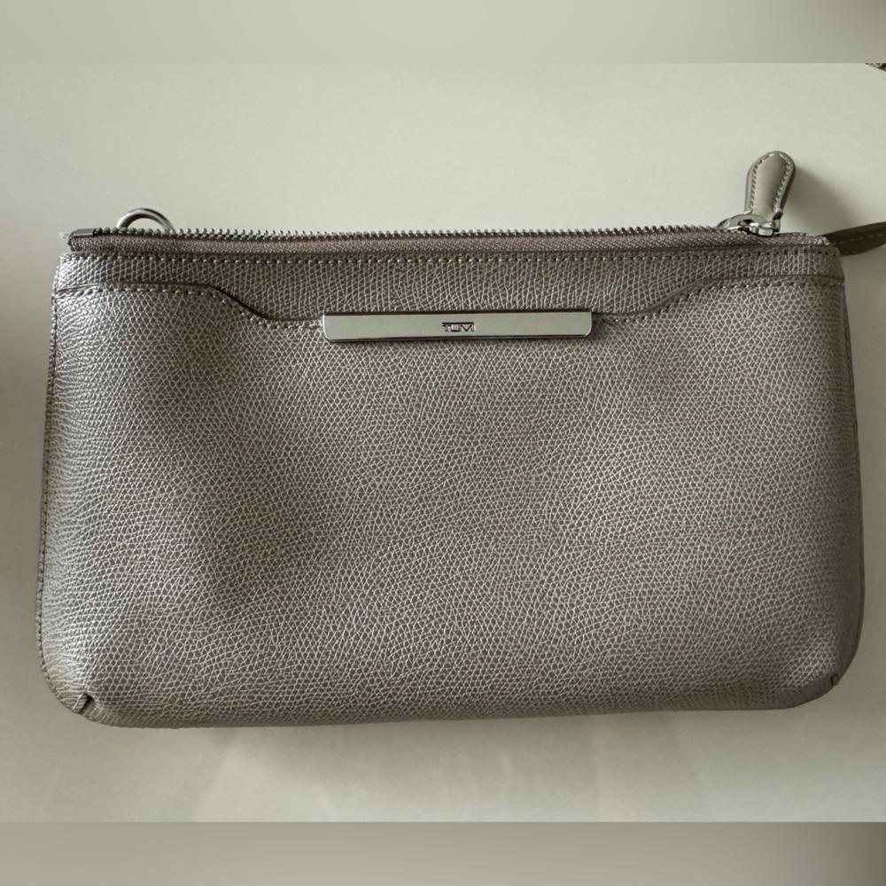 Tumi crossbody with adjustable strap